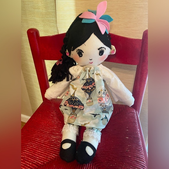 Charming Doll with Pink Bow and Patterned Dress - Picture 1 of 5